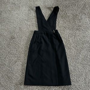 Overall dress black with pockets on each side